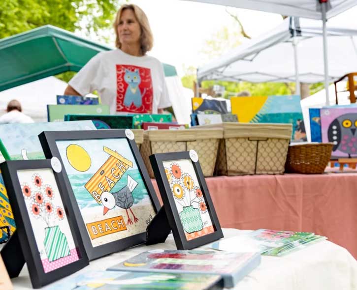 Barbara Younger exhibiting her art at an outdoor event